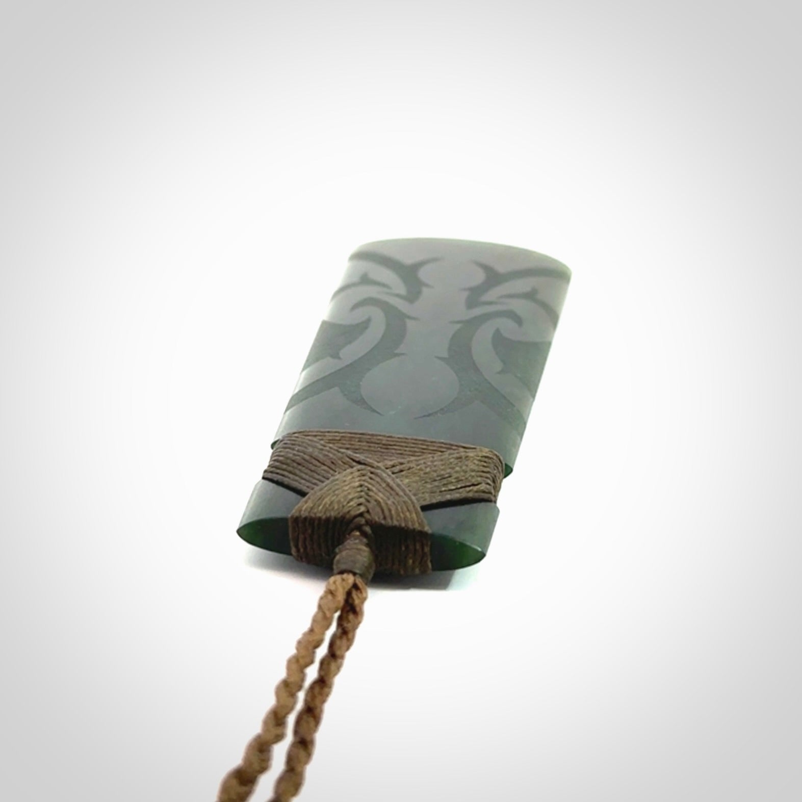 Hand made large New Zealand jade toki with koru pendant. Hand carved in New Zealand by Kerry Thompson. Unique large Jade Toki with adjustable cord.