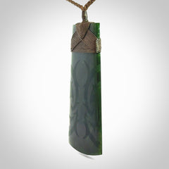 Hand made large New Zealand jade toki with koru pendant. Hand carved in New Zealand by Kerry Thompson. Unique large Jade Toki with adjustable cord.