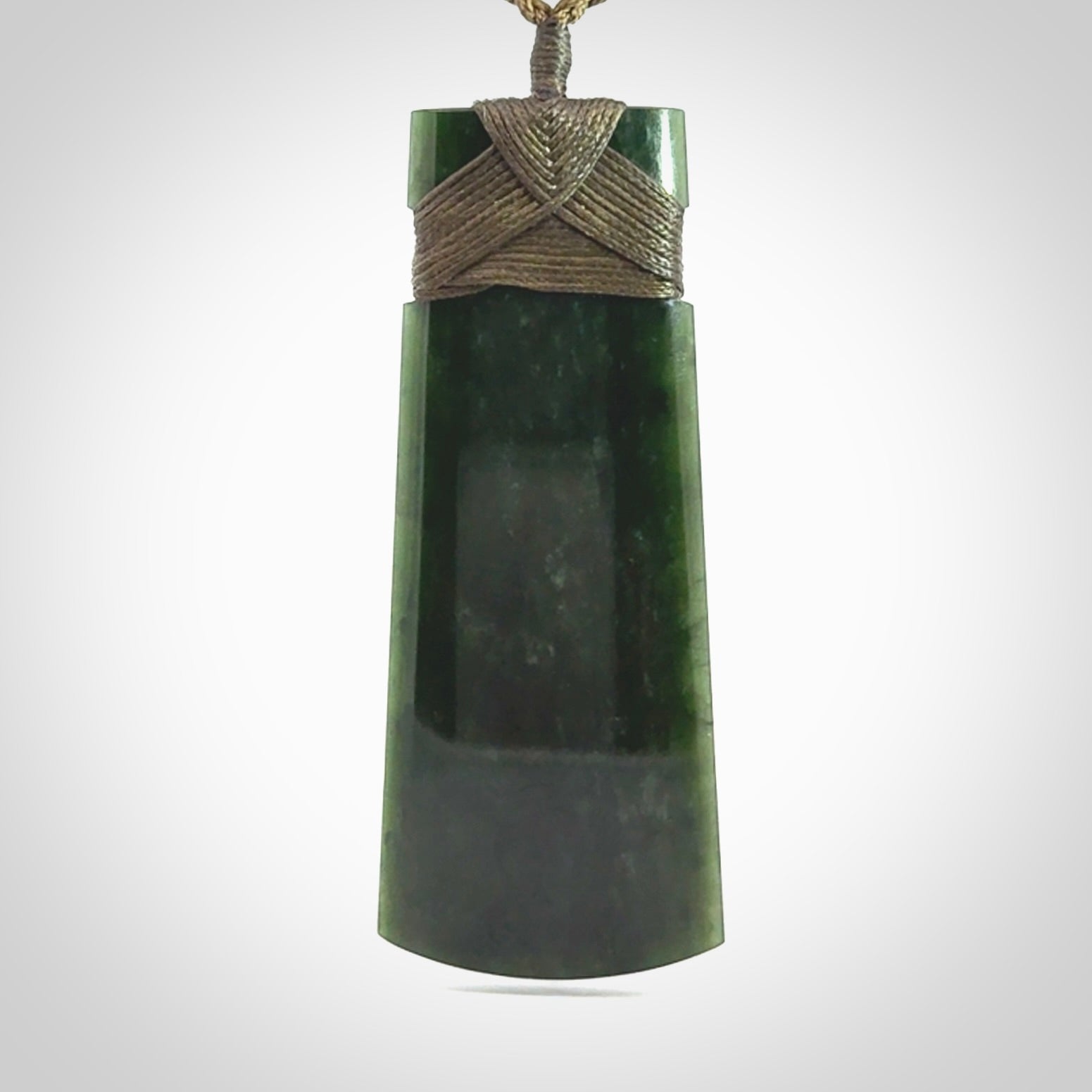 Hand made large New Zealand jade toki with koru pendant. Hand carved in New Zealand by Kerry Thompson. Unique large Jade Toki with adjustable cord.