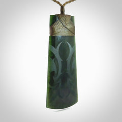 Hand made large New Zealand jade toki with koru pendant. Hand carved in New Zealand by Kerry Thompson. Unique large Jade Toki with adjustable cord.