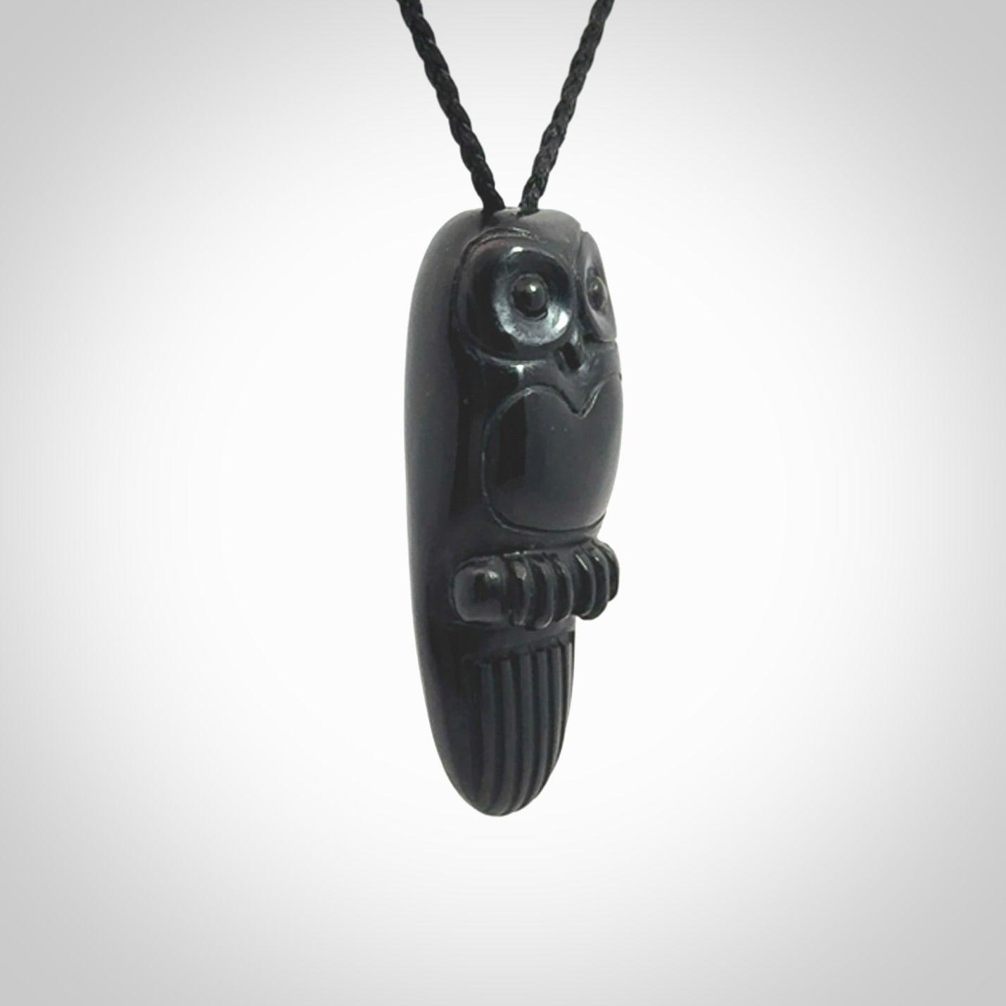 A Owl design carving, hand made for us from Australian Black Jade. This pendant is provided with an adjustable black cord.