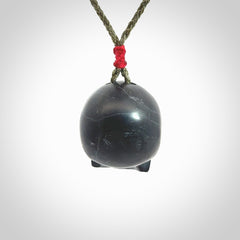 This picture shows a large Black Obsidian stone skull pendant that we have hand carved. It is polished to a soft shine and is a very striking piece. Provided with an adjustable khaki cord.