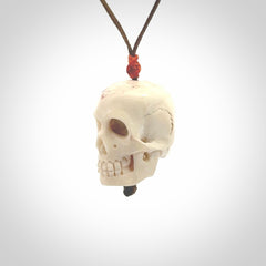 These are handmade skull pendants carved from deer antler. A fantastic piece if you like skulls and would like a medium sized piece. The cord is adjustable so you can wear this where it suits you best. We ship these free worldwide.