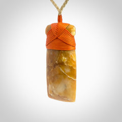 This is a beautiful hand carved Agate toki pendant. Provided with an adjustable cord and packaged in a woven kete pouch.