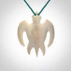 Hand carved bone turtle pendant. Delivered with an adjustable blue cord and packaged in a woven kete pouch.
