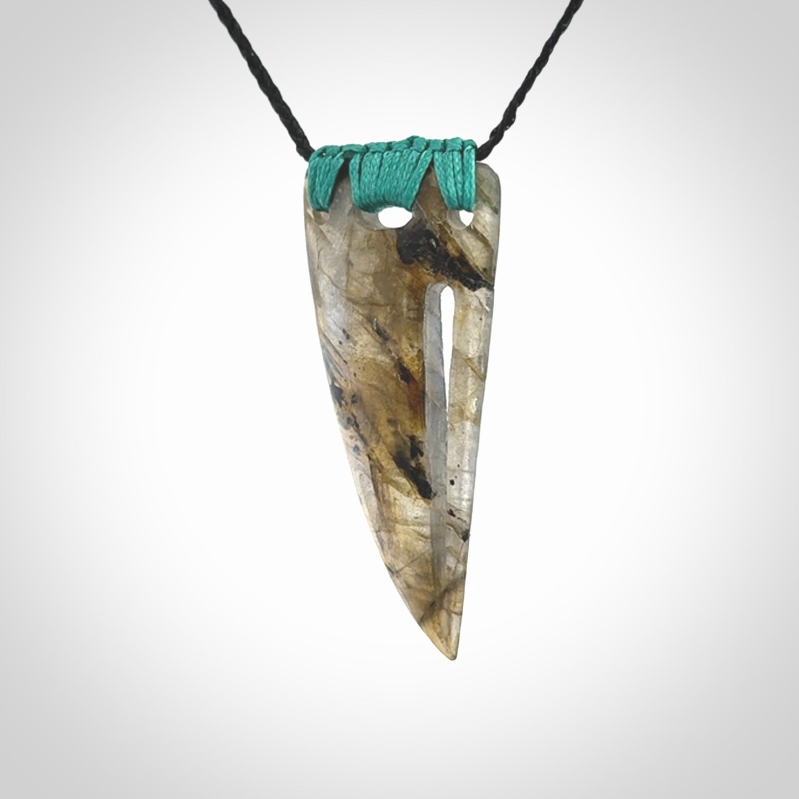 This picture shows a Labradorite stone drop pendant that we have hand carved.