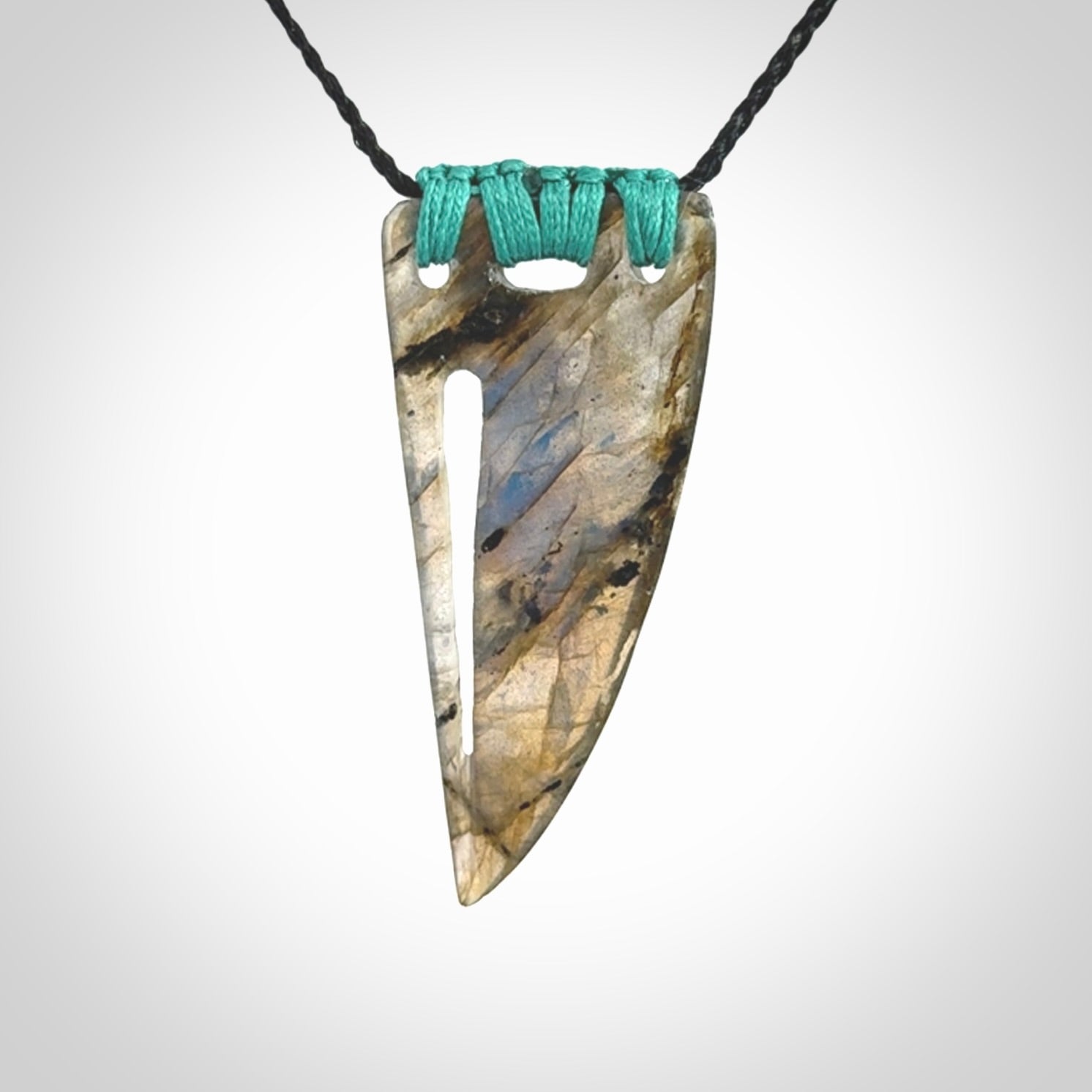 This picture shows a Labradorite stone drop pendant that we have hand carved.