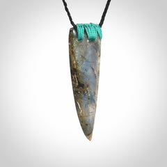 This picture shows a Labradorite stone drop pendant that we have hand carved.