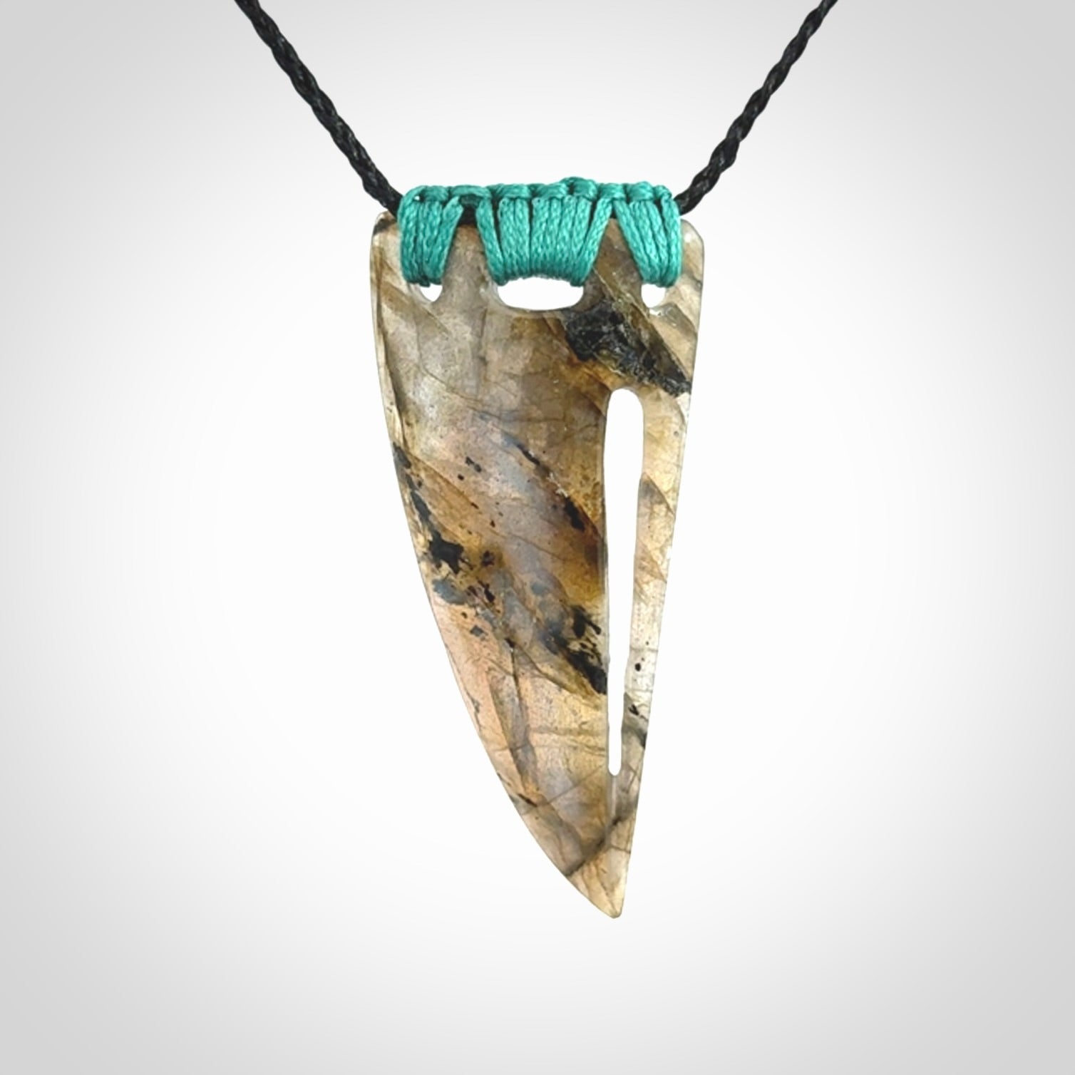 This picture shows a Labradorite stone drop pendant that we have hand carved.