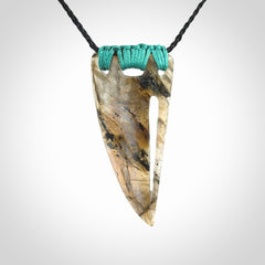 This picture shows a Labradorite stone drop pendant that we have hand carved.