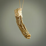 Hand carved dragon Pendant. Made from warthog tusk in New Zealand. Unique dragon necklace hand made from warthog tusk by master bone carver Fumio Noguchi. Spectacular collectable work of art, made to wear. One only pendant, delivered to you at no extra cost with express courier.