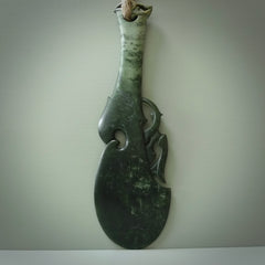 Hand carved wahaika Pounamu. Art to display. One only hand made wahaika display piece with base. New Zealand wahaika carved in Pounamu, Jade by Kerry Thompson. Free delivery worldwide.