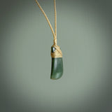 Hand carved jade toki by Ric Moor. Made in New Zealand by NZ Pacific. Hand carved Toki pendants crafted from beautiful New Zealand Pounamu, Jade. We deliver these with Express Courier, on adjustable cords.
