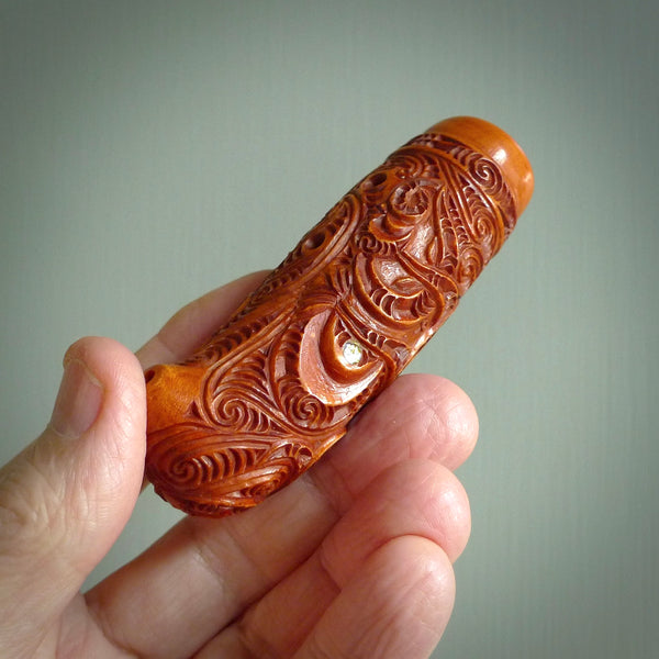 A traditional hand carved Māori Kōauau flute. This piece is made from bone and is a fully functioning musical instrument and can be played. Beautiful ethnic art hand made by NZ Pacific.