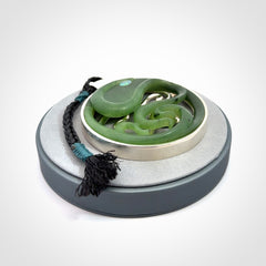 A hand carved New Zealand Jade and Sterling Silver Octopus pendant with Opal eye. Hand made by New Zealand artist Kerry Thompson.