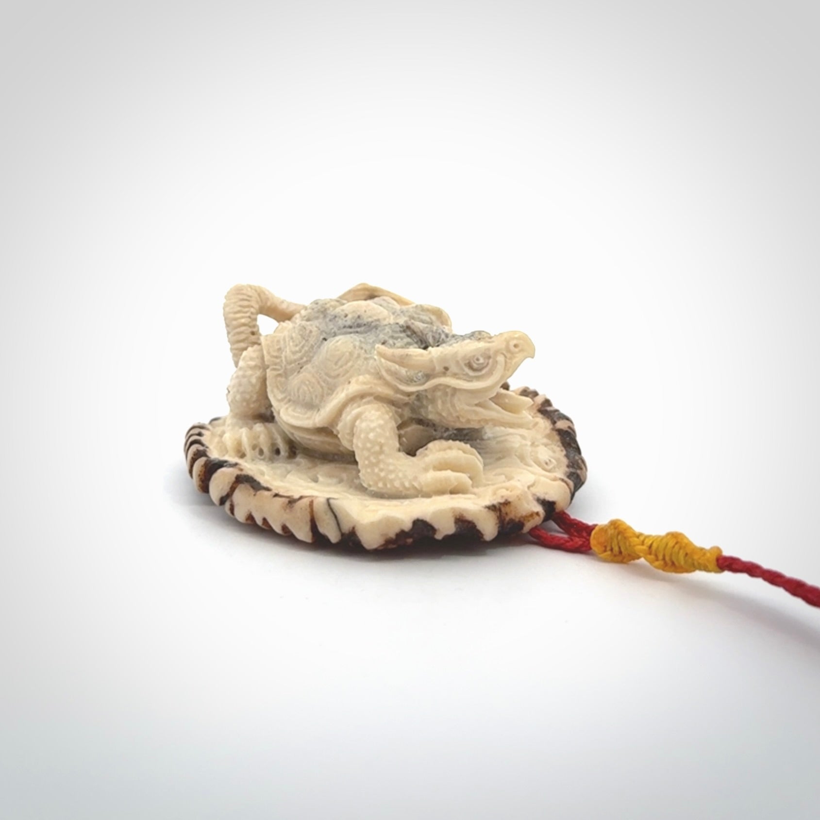 Hand carved deer antler dragon turtle pendant