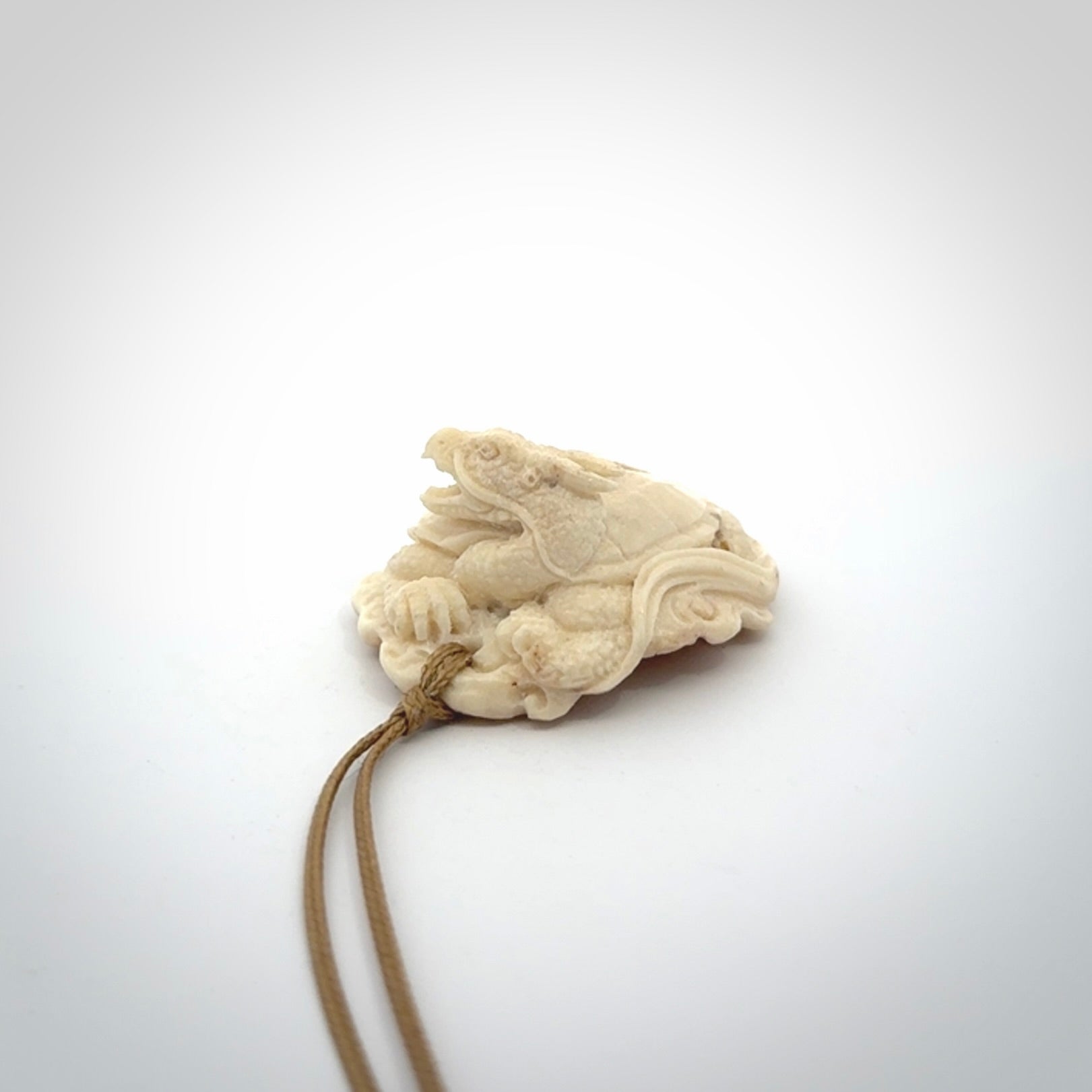 Hand carved deer antler dragon turtle pendant