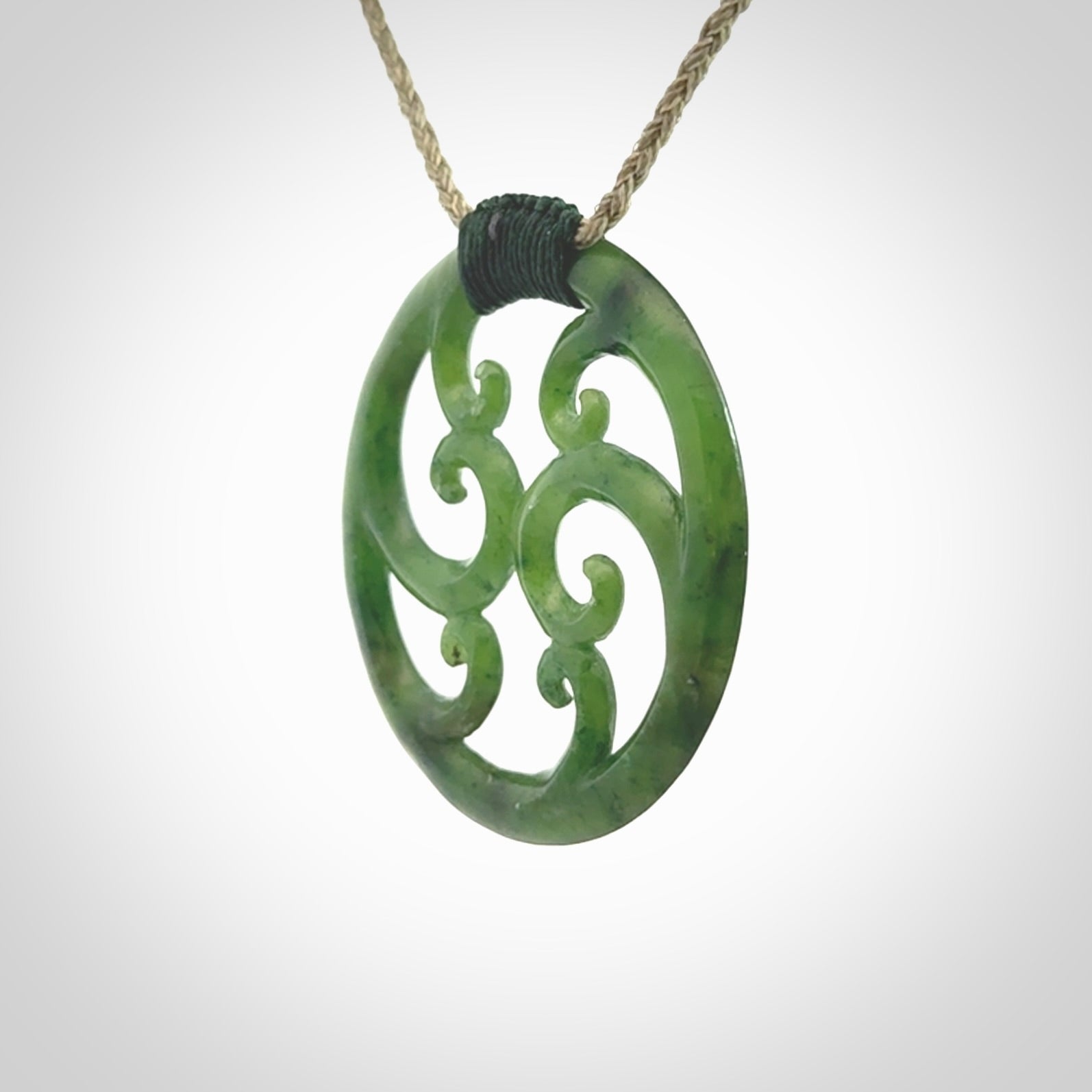 This picture shows a large, rolling koru design with six koru florets unfurling from the centre.