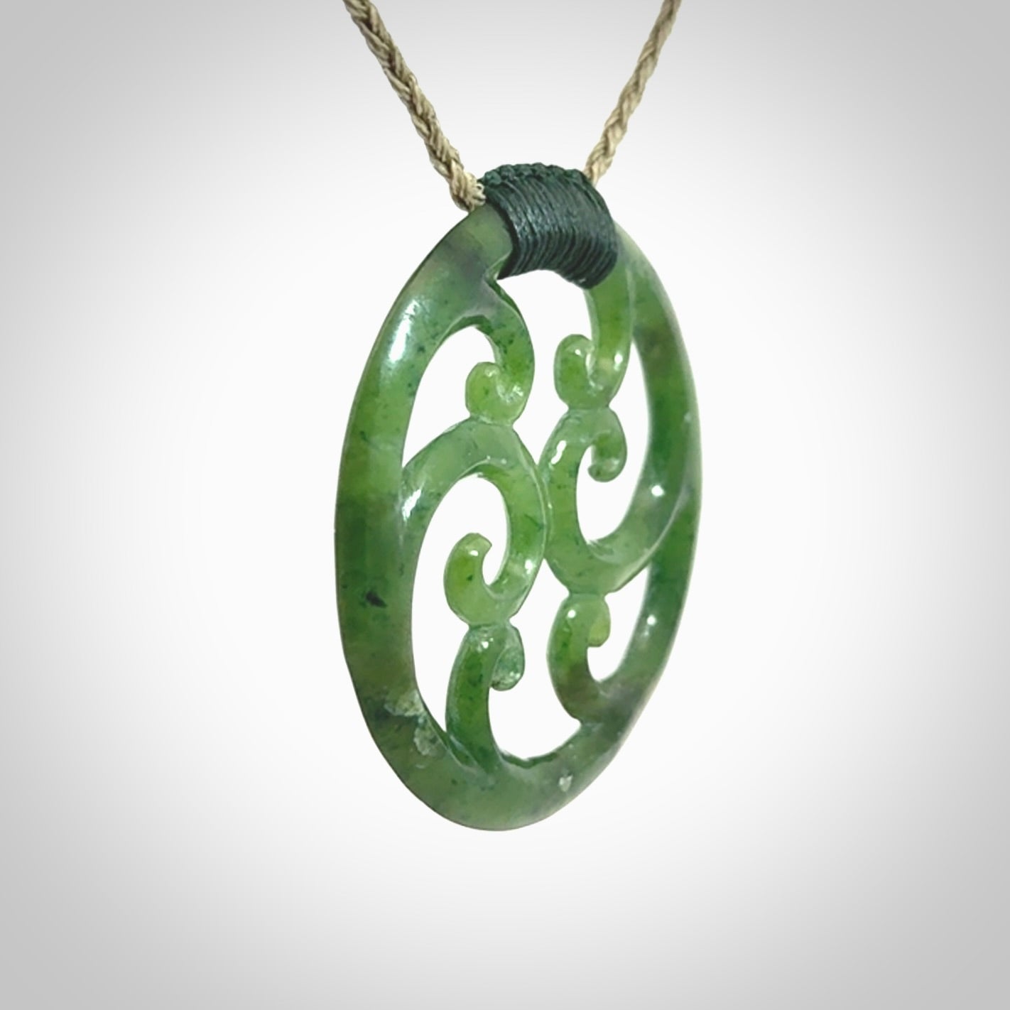 This picture shows a large, rolling koru design with six koru florets unfurling from the centre.