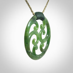 This picture shows a large, rolling koru design with six koru florets unfurling from the centre.