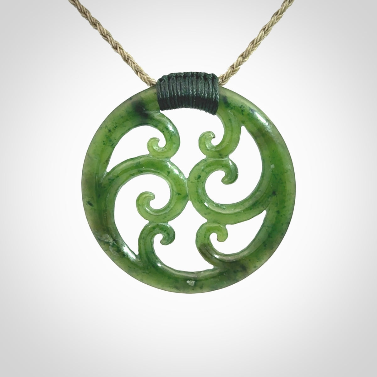 This picture shows a large, rolling koru design with six koru florets unfurling from the centre.