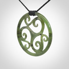 This picture shows a large, rolling koru design with six koru florets unfurling from the centre.