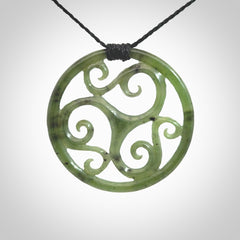 This picture shows a large, rolling koru design with six koru florets unfurling from the centre.