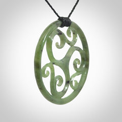 This picture shows a large, rolling koru design with six koru florets unfurling from the centre.