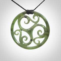 This picture shows a large, rolling koru design with six koru florets unfurling from the centre.