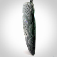 This is a large hand carved New Zealand Jade chief head display art. It is made from New Zealand Jade and Paua shell.