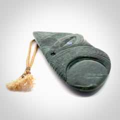 This is a large hand carved New Zealand Jade wheku pendant. It is made from New Zealand Jade and Paua shell.