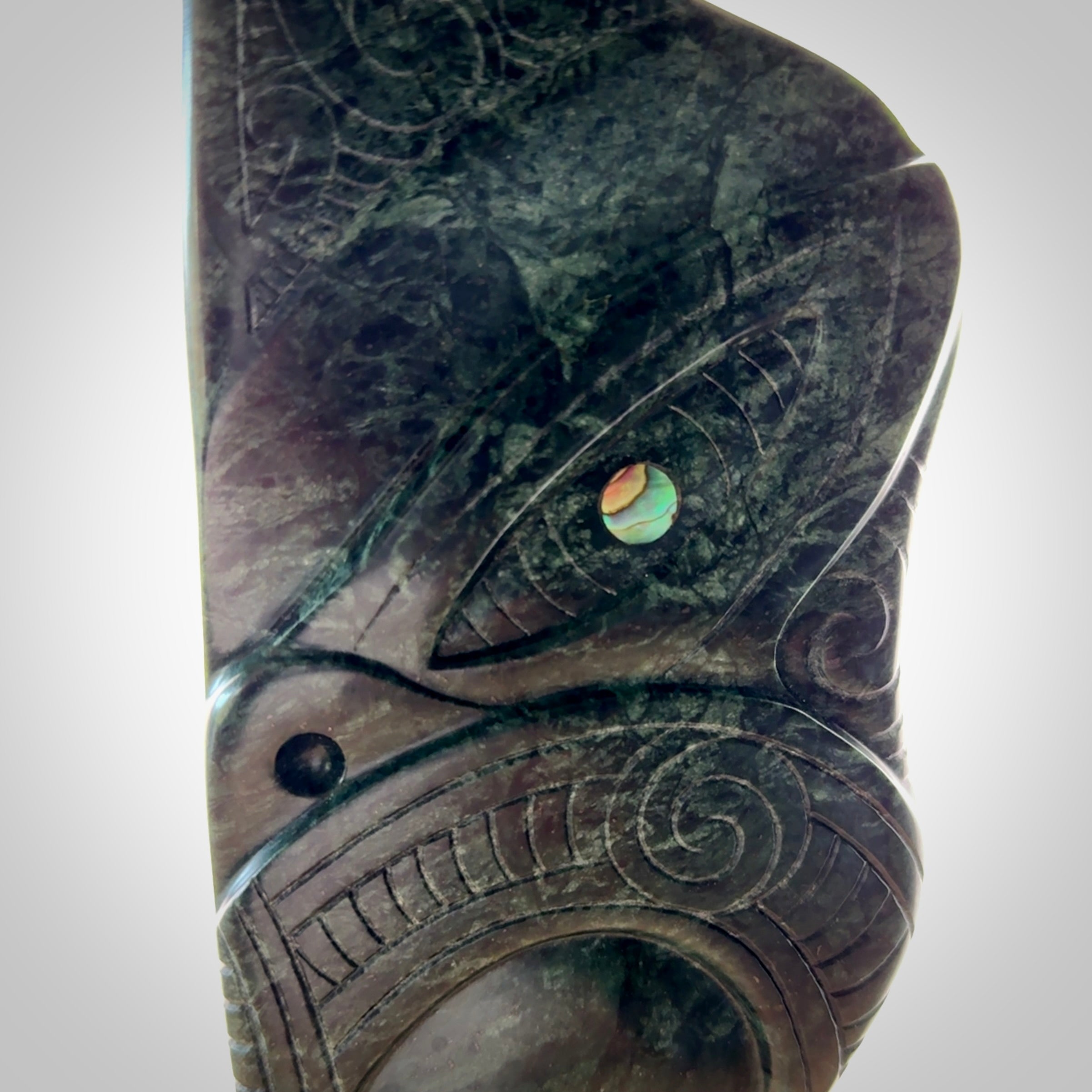 This is a large hand carved New Zealand Jade wheku pendant. It is made from New Zealand Jade and Paua shell.
