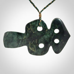 This is a large hand carved New Zealand Jade tiki pendant. It is made from New Zealand Jade and Paua shell.