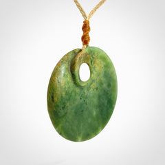 Hand carved New Zealand Flower Jade disc pendant