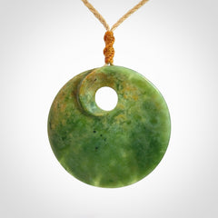 Hand carved New Zealand Flower Jade disc pendant