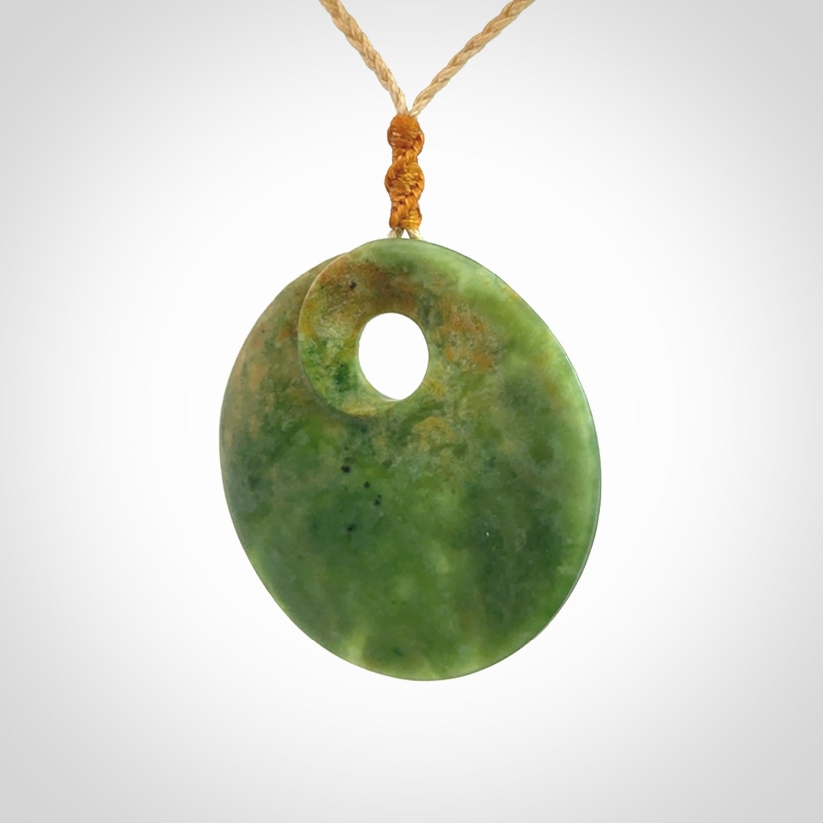 Hand carved New Zealand Flower Jade disc pendant