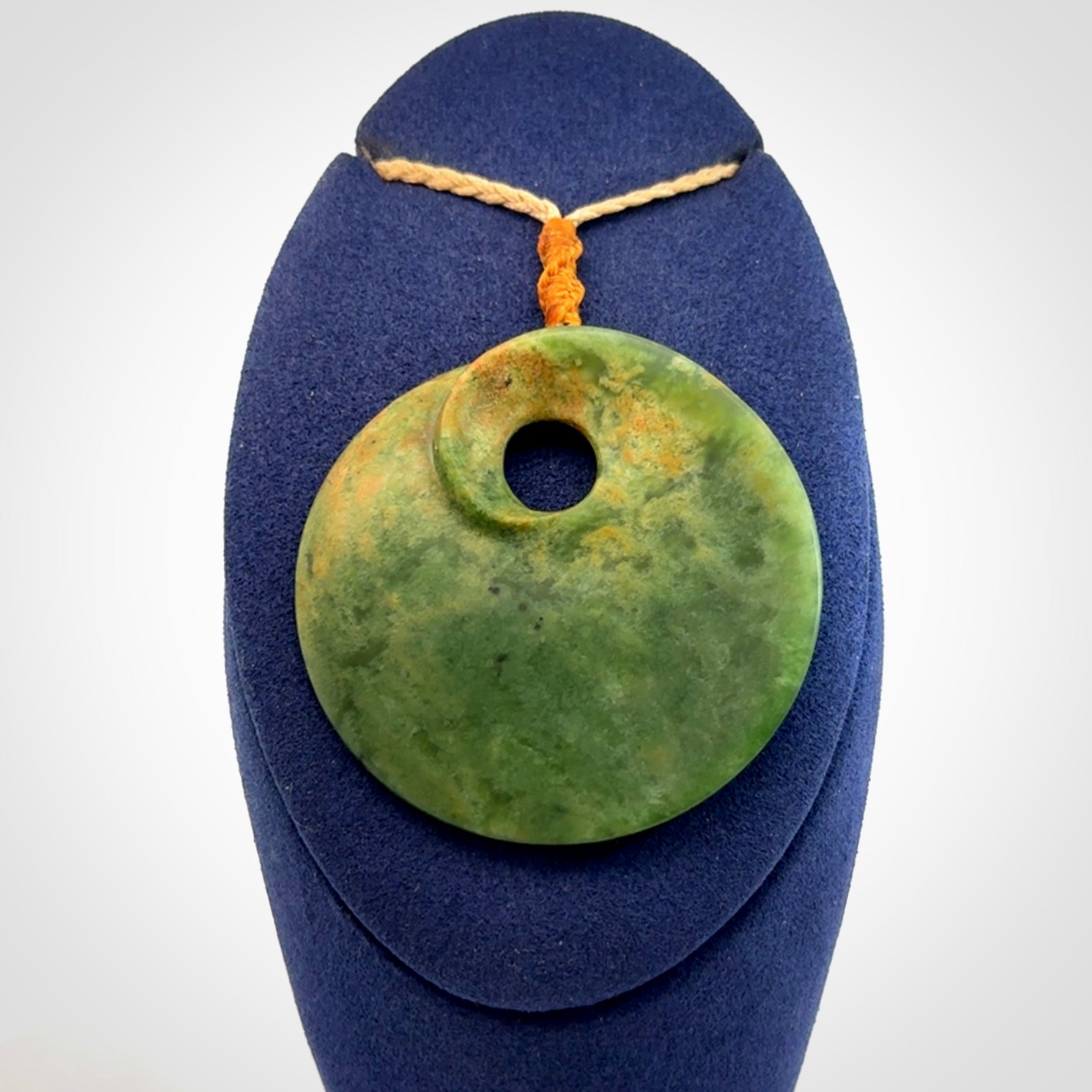 Hand carved New Zealand Flower Jade disc pendant