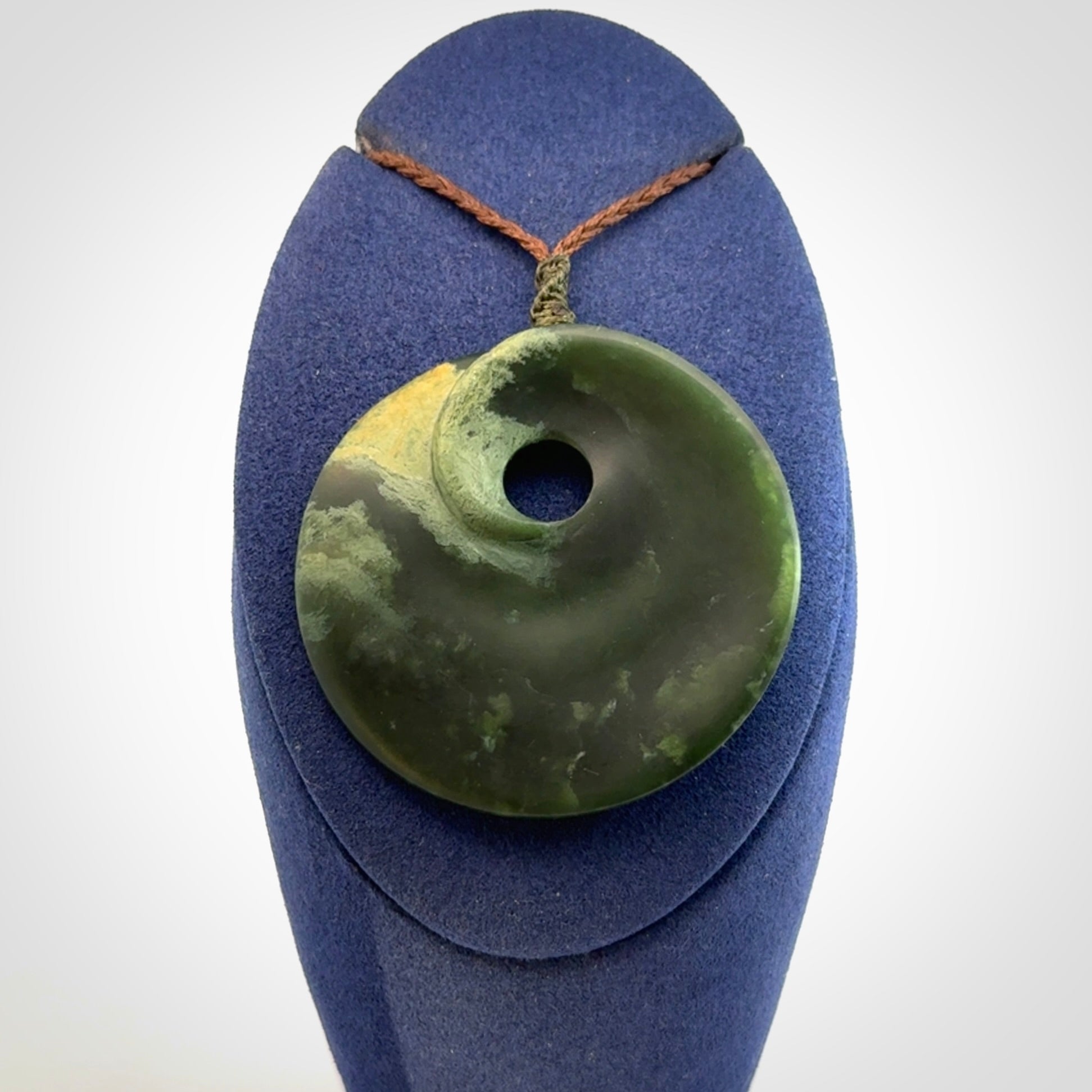 Hand carved New Zealand Jade disc pendant
