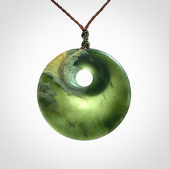 Hand carved New Zealand Jade disc pendant