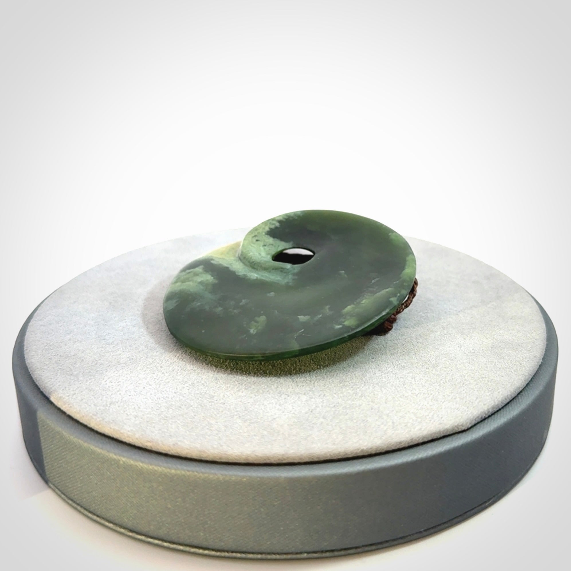Hand carved New Zealand Jade disc pendant