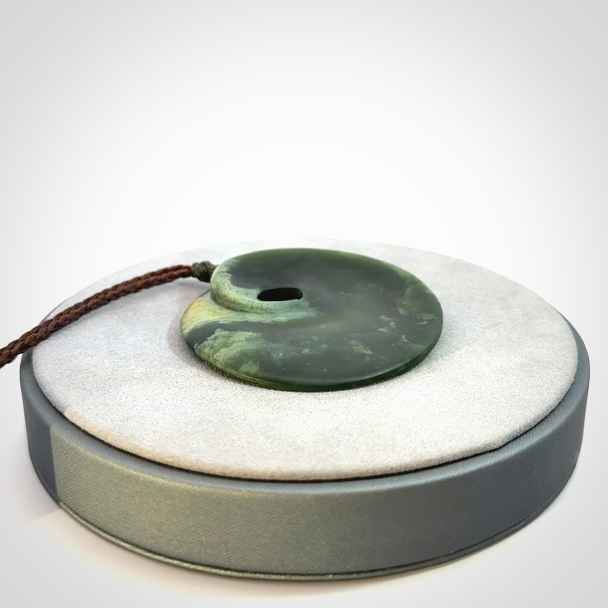 Hand carved New Zealand Jade disc pendant