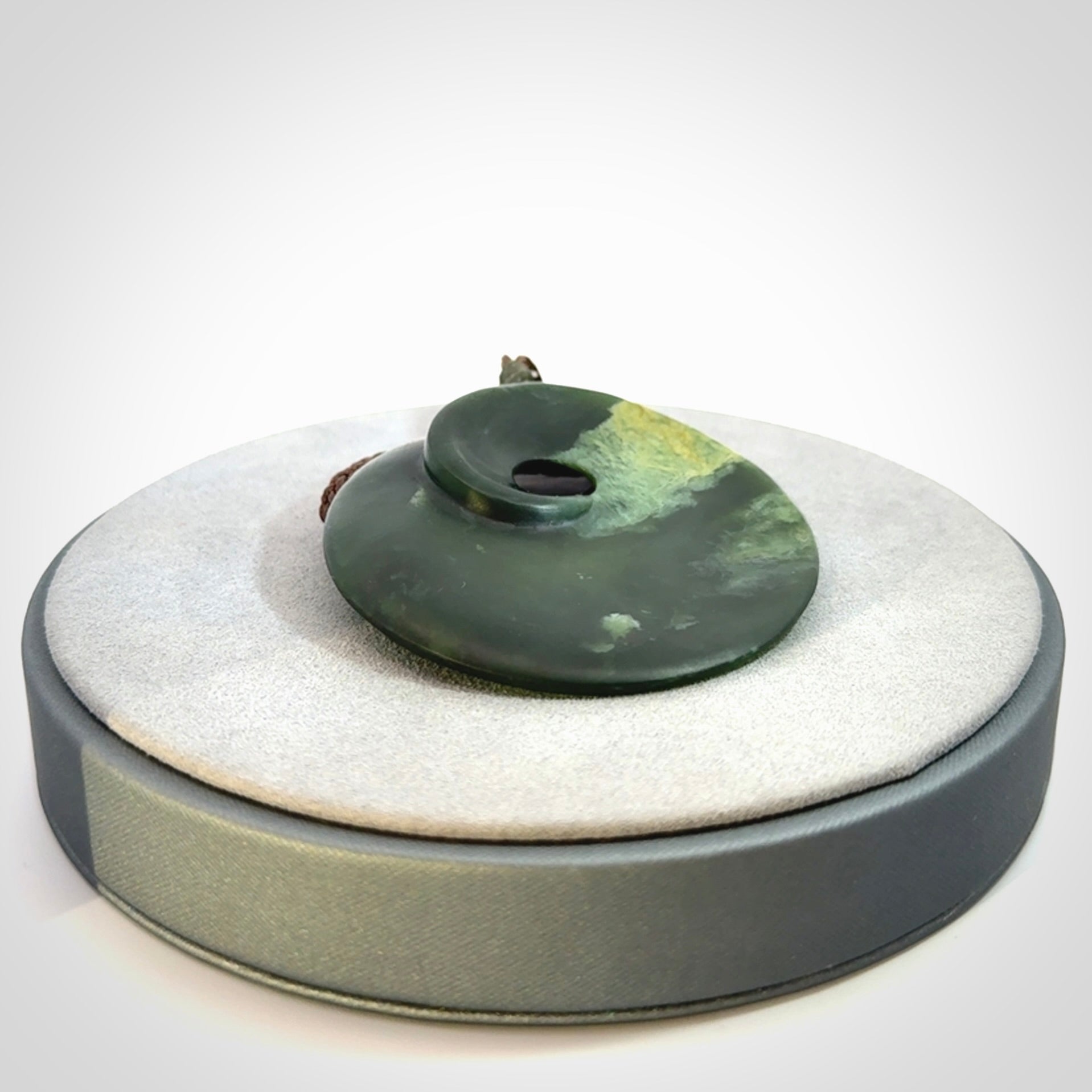 Hand carved New Zealand Jade disc pendant