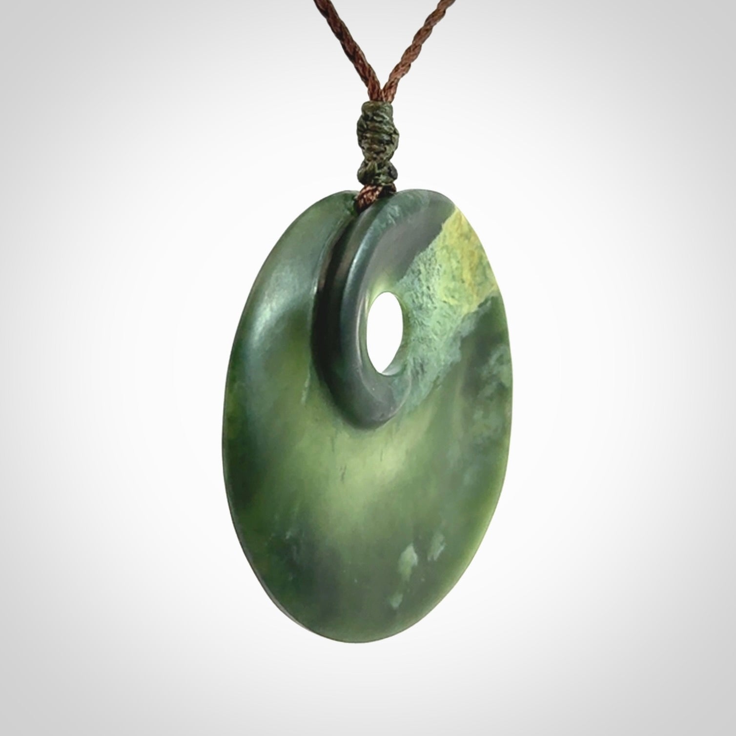 Hand carved New Zealand Jade disc pendant