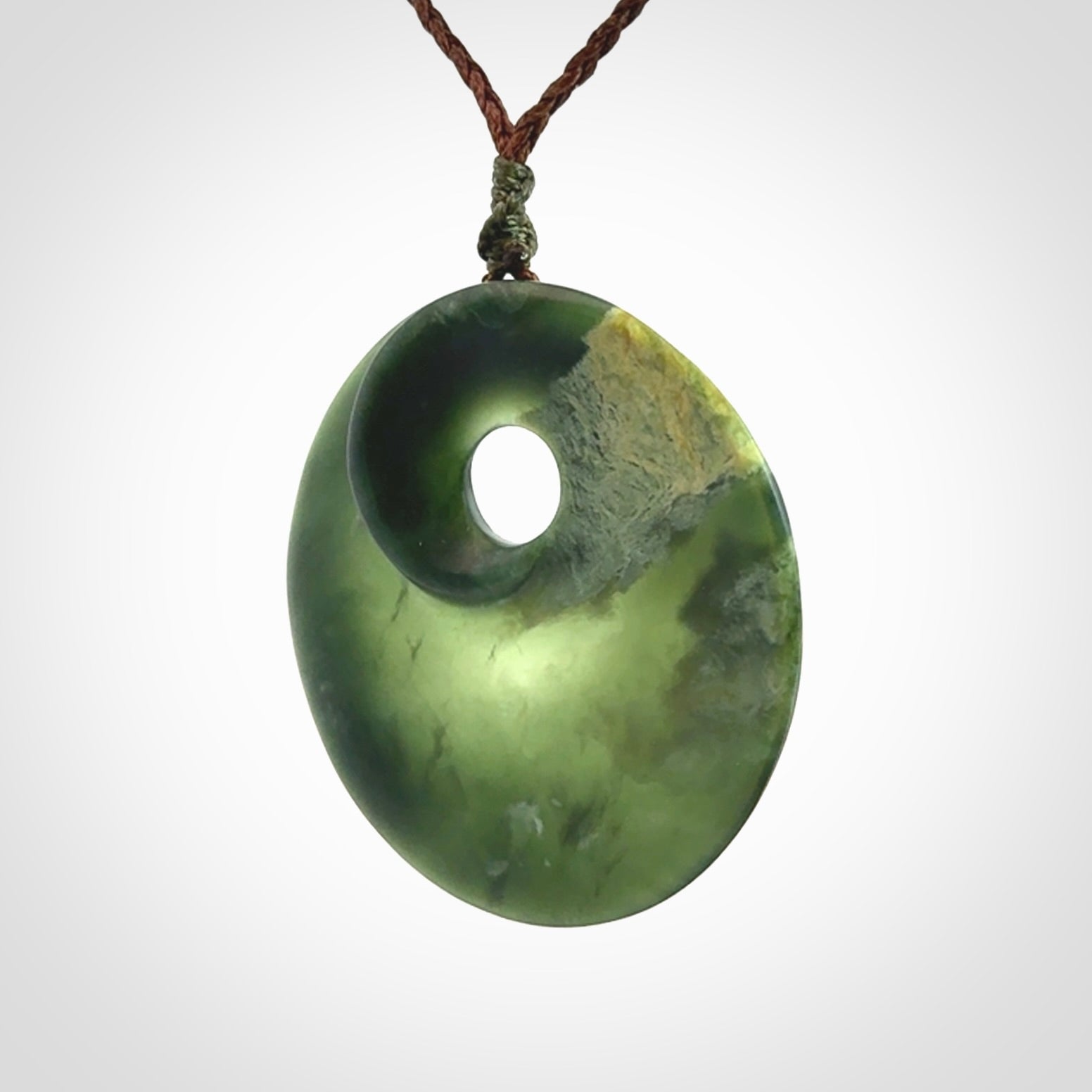 Hand carved New Zealand Jade disc pendant