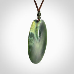 Hand carved New Zealand Jade disc pendant