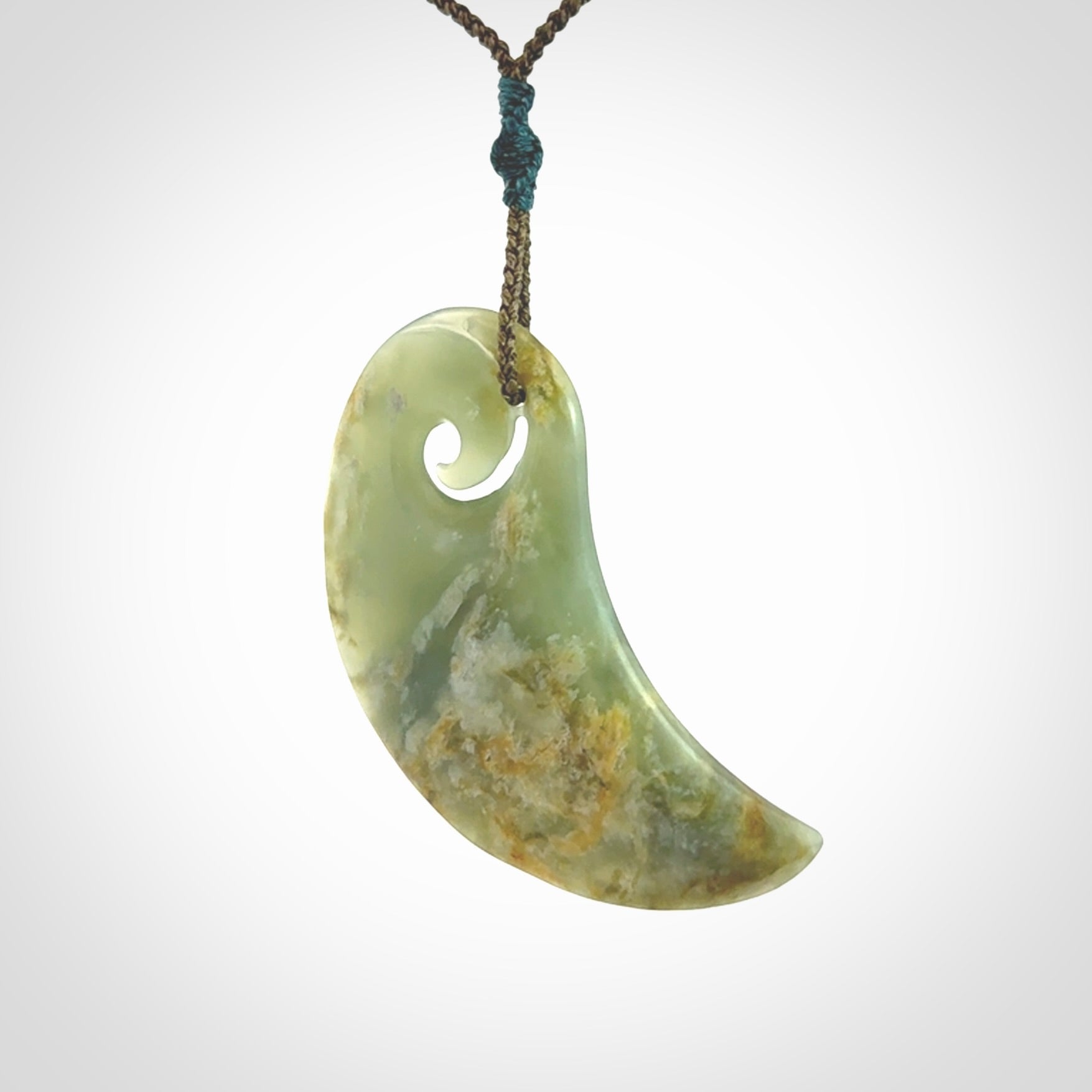 Beautifully Carved Koru drop pendant in delightful Jade