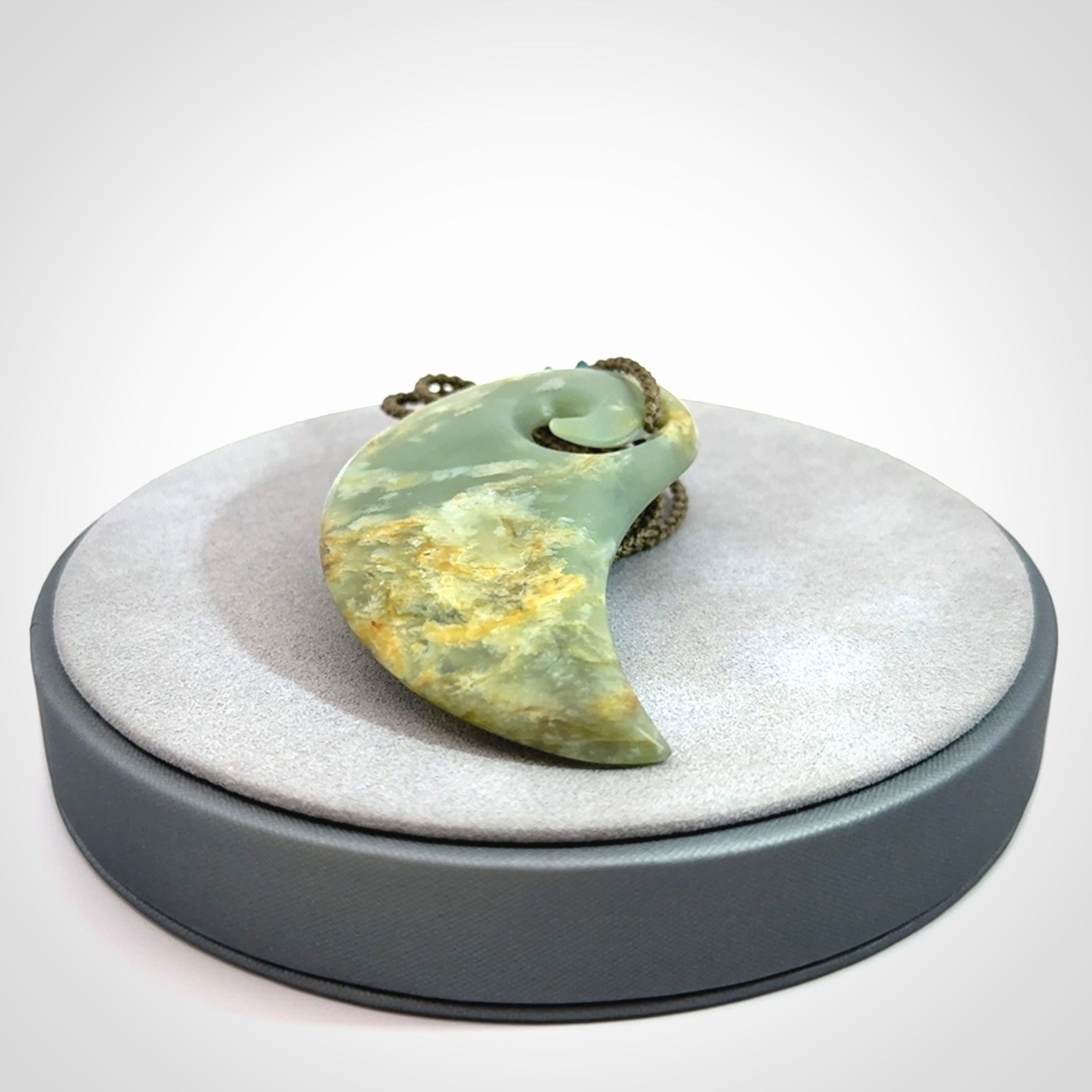 Beautifully Carved Koru drop pendant in delightful Jade