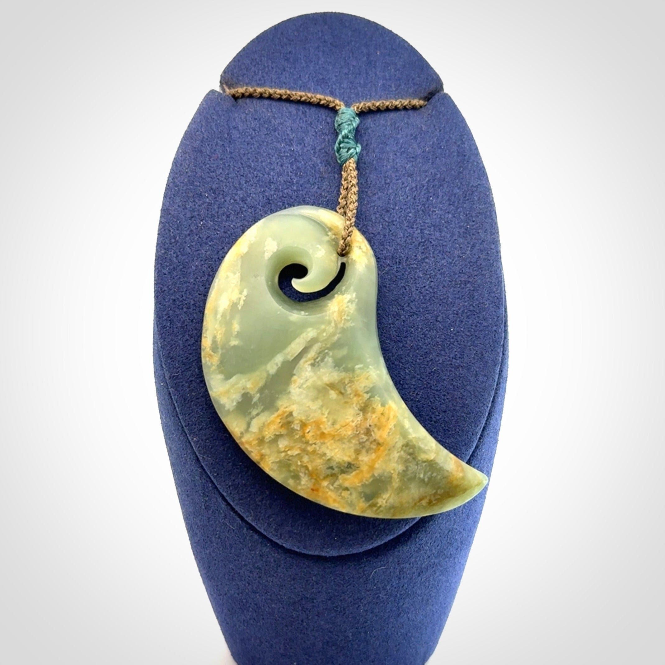 Beautifully Carved Koru drop pendant in delightful Jade