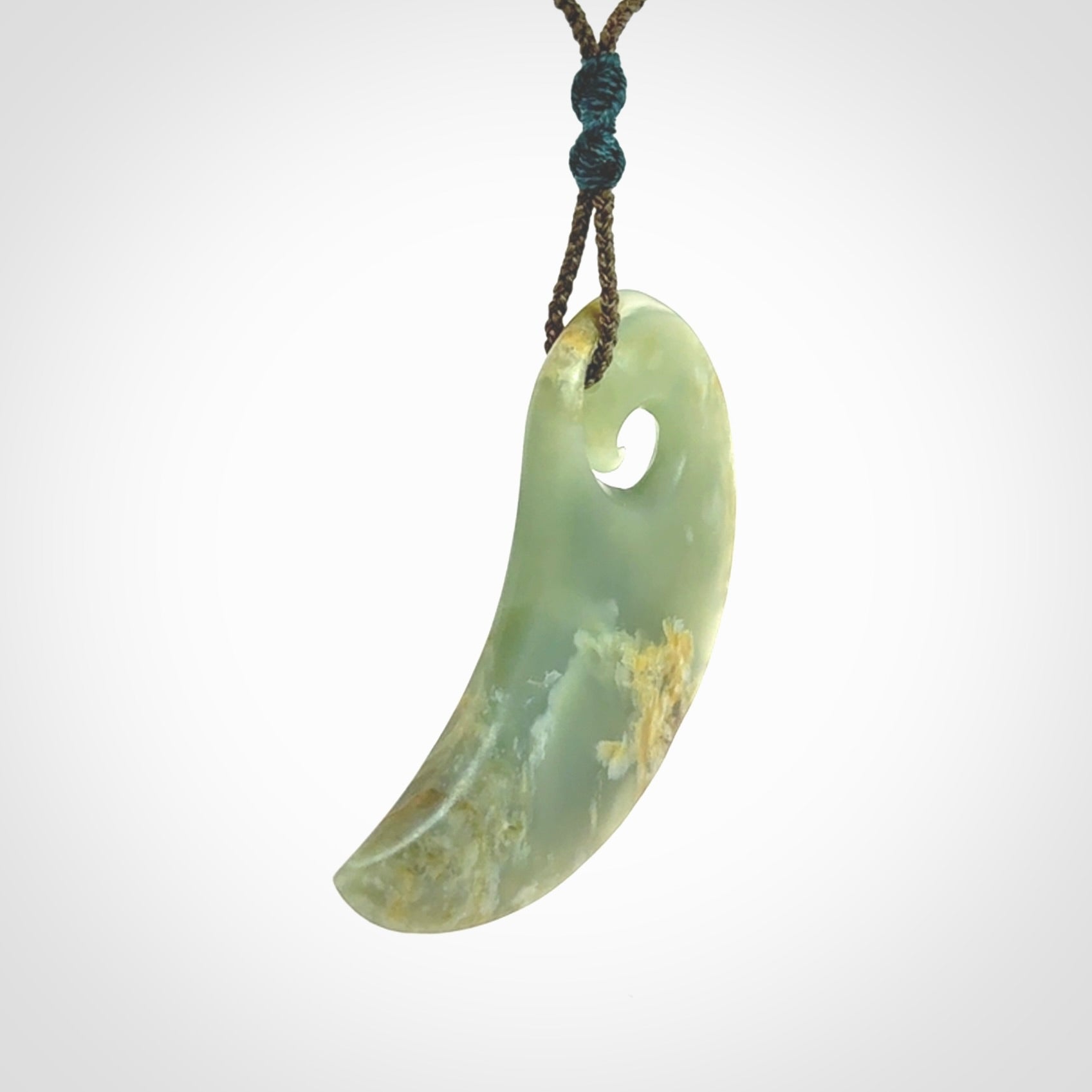 Beautifully Carved Koru drop pendant in delightful Jade