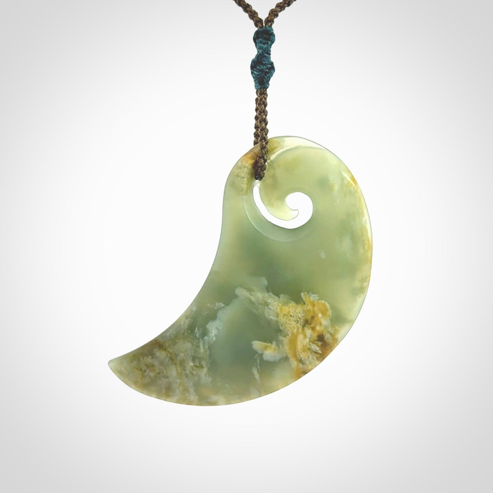 Beautifully Carved Koru drop pendant in delightful Jade